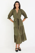Woman wearing a green dress on a white background