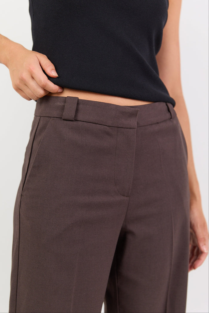 Brown pants worn by a person on a white background
col_pattern