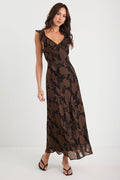 Woman wearing a black floral lace dress on a white background