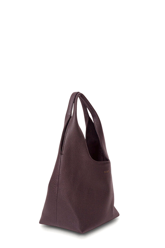 Brown leather handbag on a white background