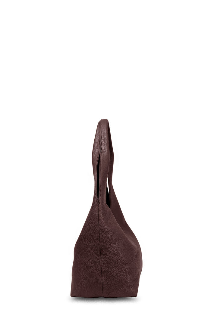 Brown leather handbag on a white background