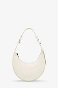 White handbag on a light beige background
