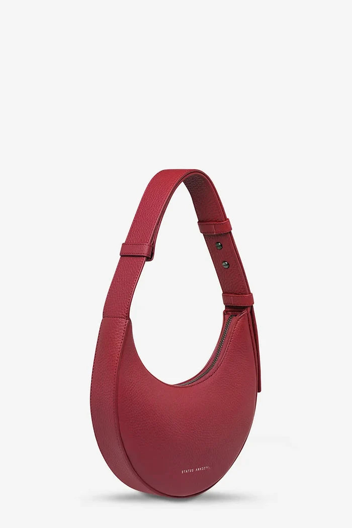 Red handbag on a light gray background