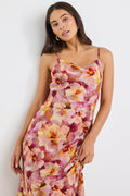 model wears a pink floral maxi dress
