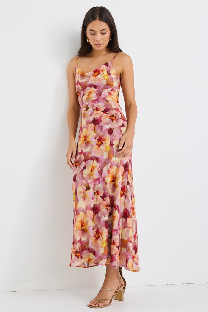 model wears a pink floral maxi dress