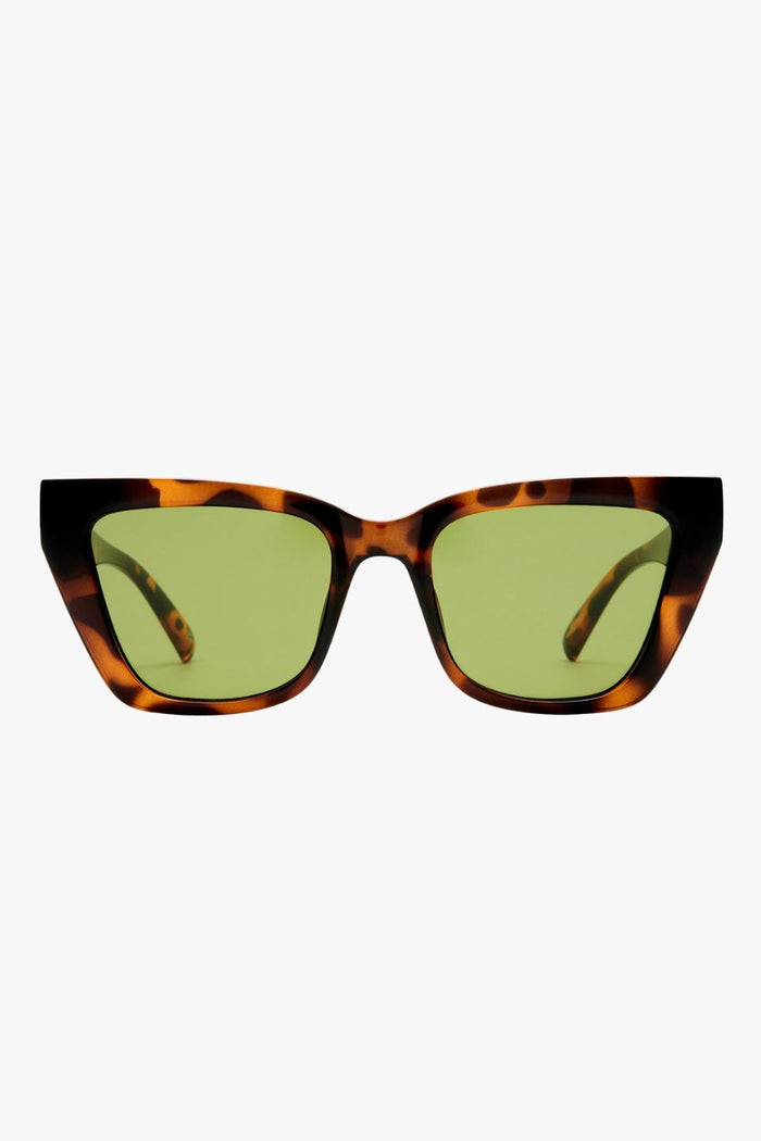 Dark tortoiseshell cat-eye sunglasses with angular frames and moss green lenses