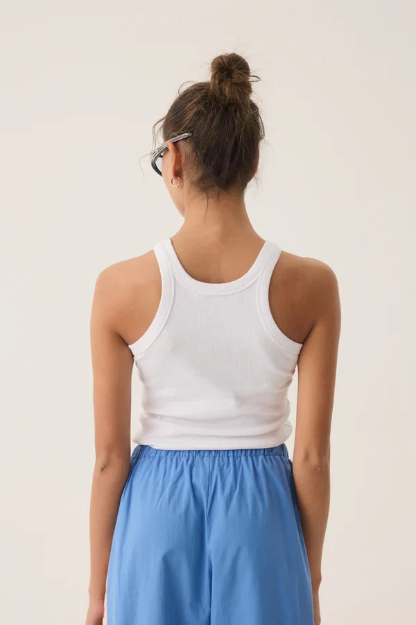 woman wearing a white tank top with a lobster print