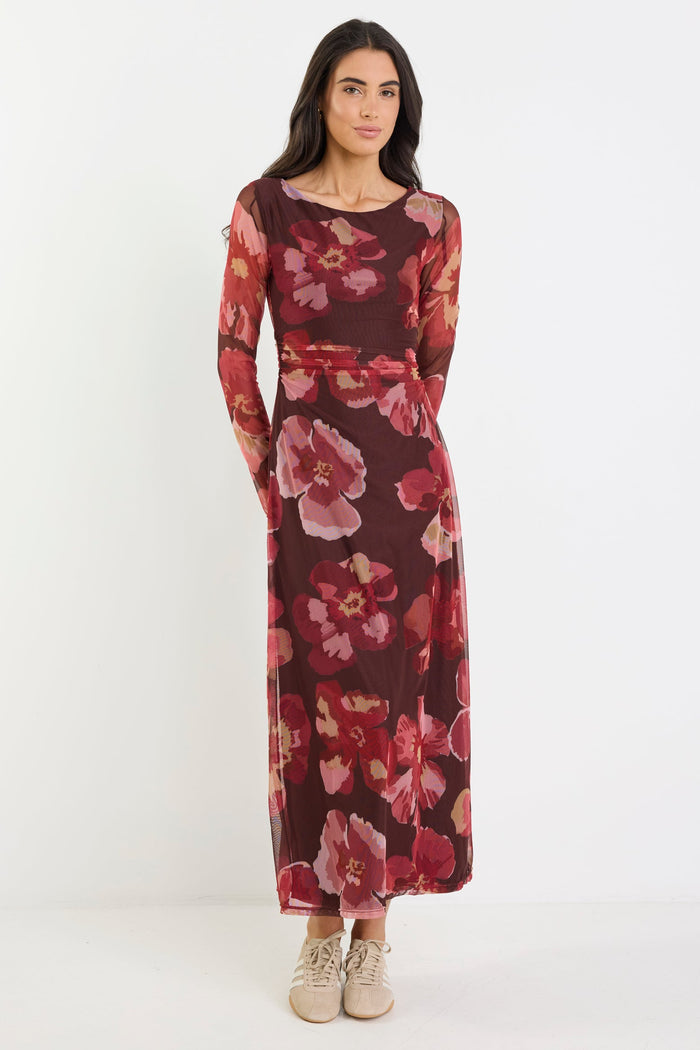 Woman wearing a floral dress on a white background