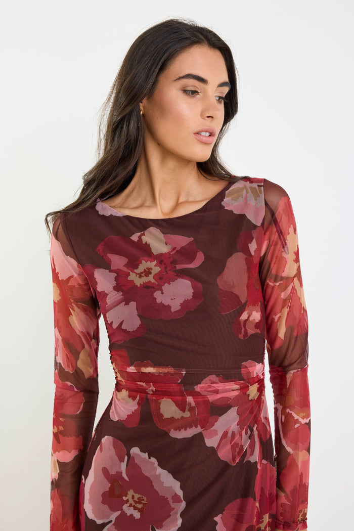 Woman wearing a floral dress with a white background
