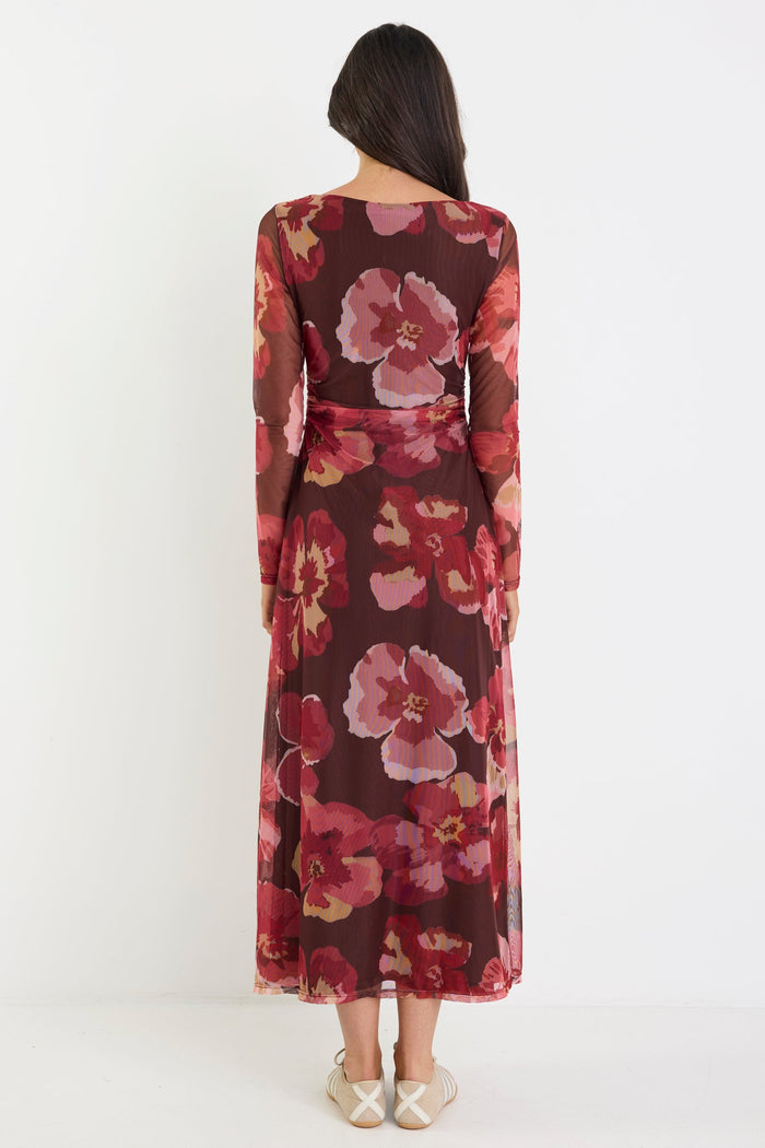 Woman wearing a floral dress with a white background