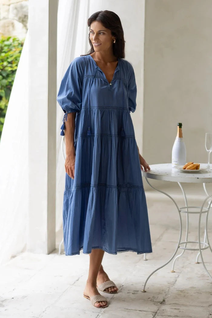 Woman wears a navy blue maxi dress