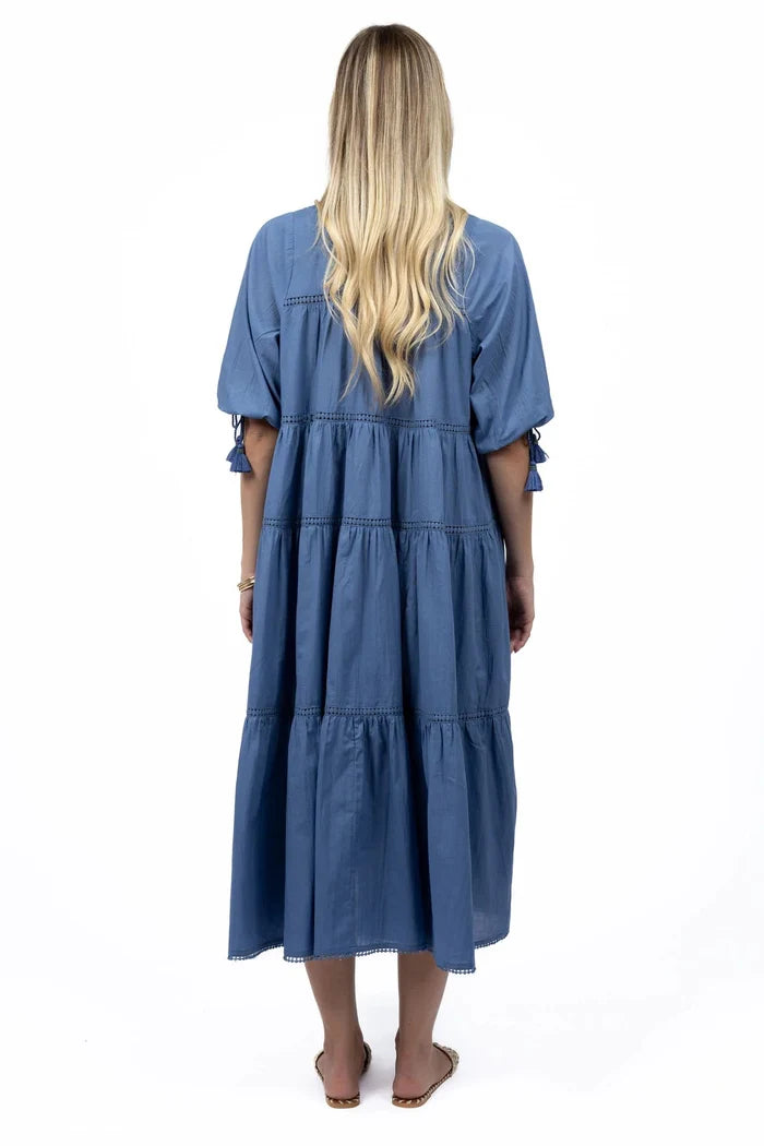 Woman wears a navy blue maxi dress