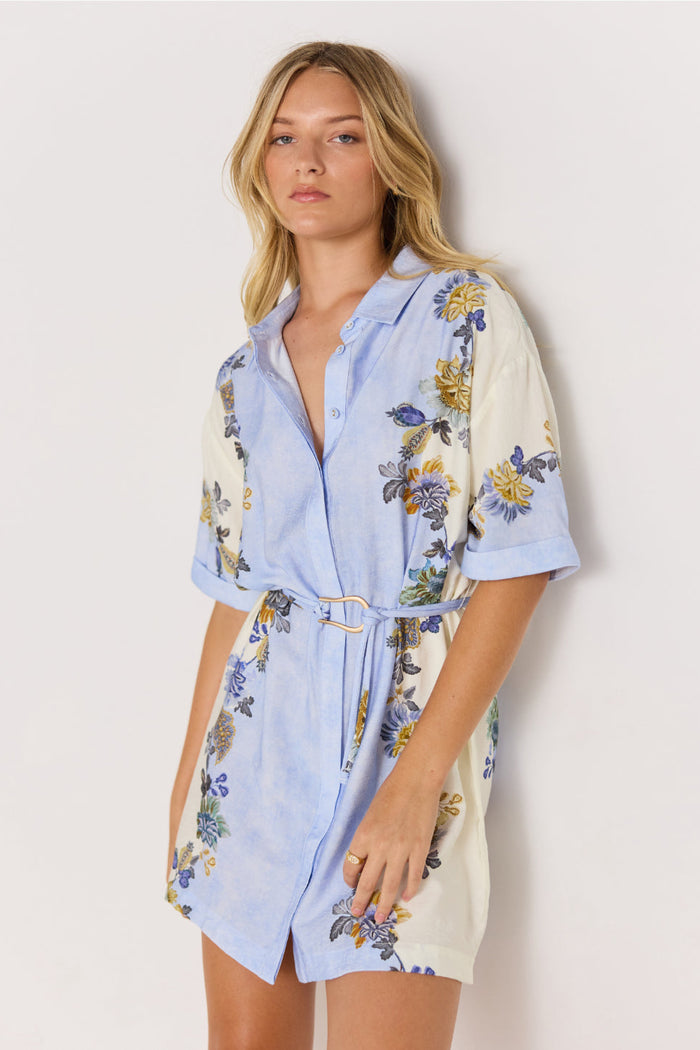 Woman wearing a floral dress with a white background