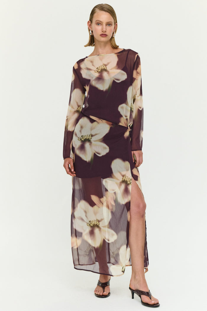 Woman wearing a floral dress on a white background