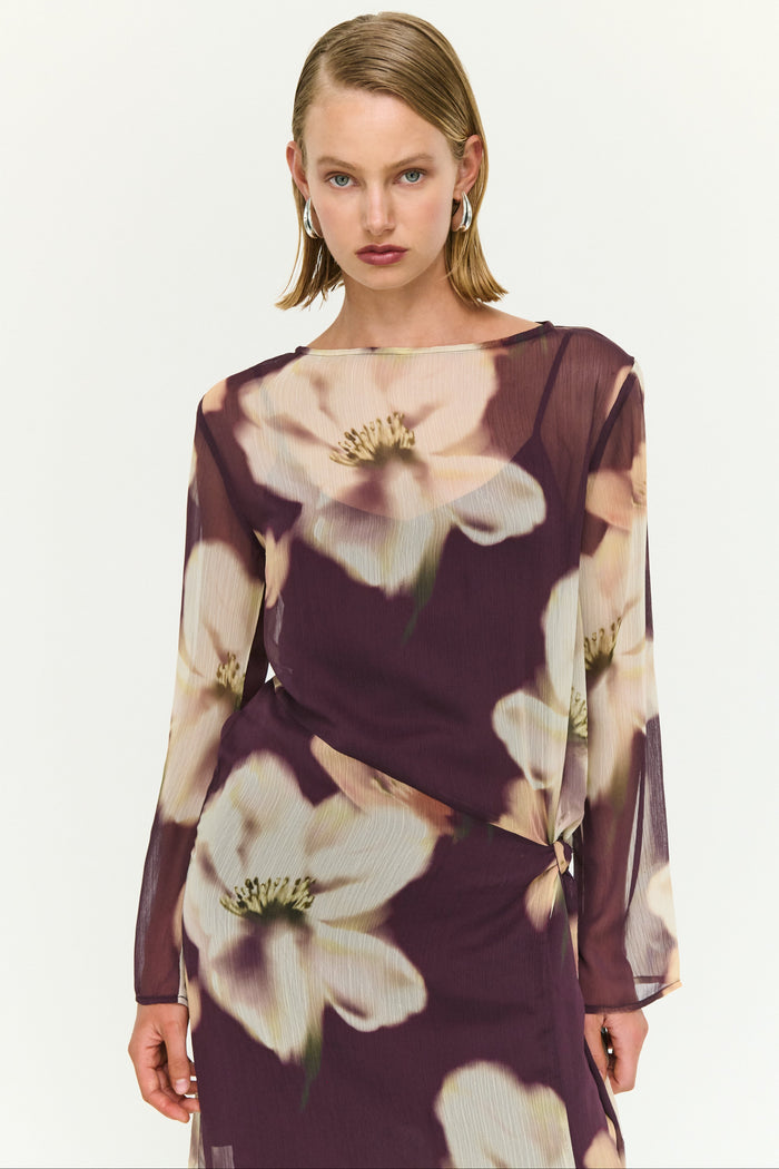 Woman wearing a floral dress with a white background