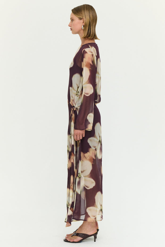 Woman wearing a floral dress on a white background