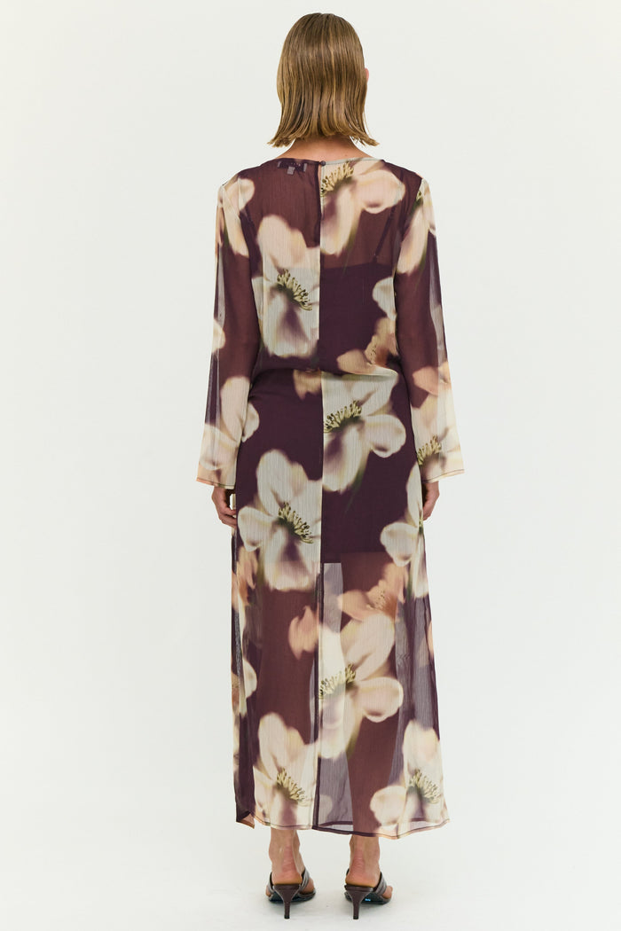 Woman wearing a floral dress on a white background