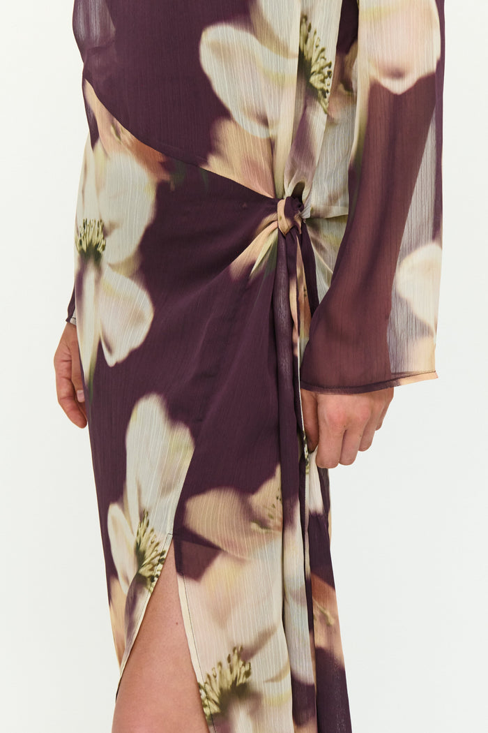 Floral dress with a tie waist on a white background