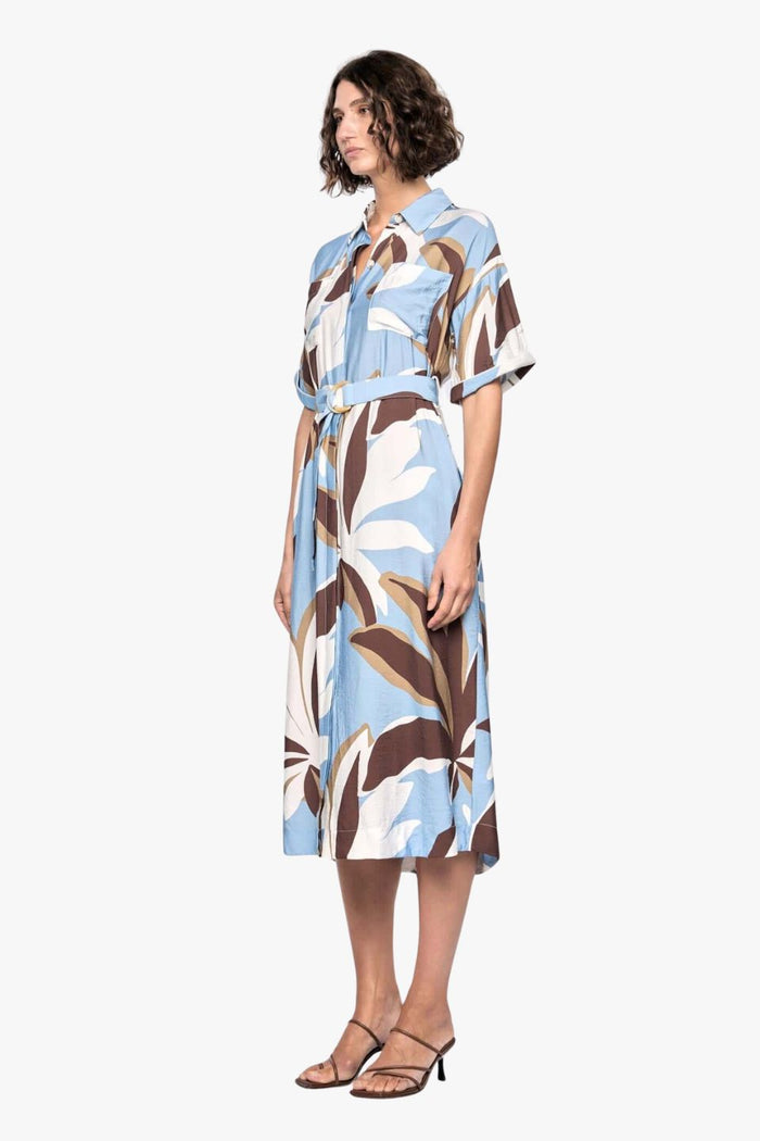 model wears a blue white brown pattern midi shirt dress