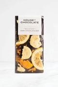 A packaged dark chocolate bar from House of Chocolate, featuring dried citrus slices and orange zest printed on the front of the wrapper, set against a clean white background.