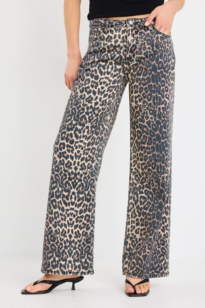 Leopard print pants worn by a person on a white background
