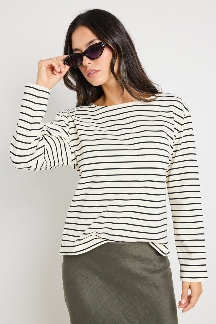 model wears stripe long sleeve black and white boat neck tee