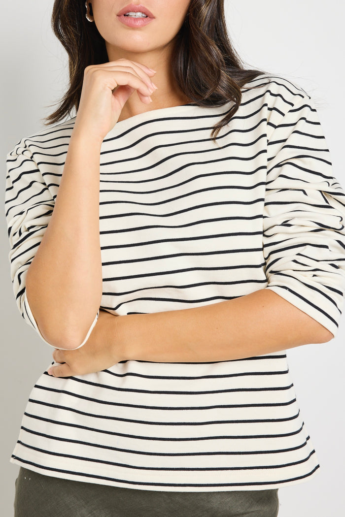 model wears stripe long sleeve black and white boat neck tee