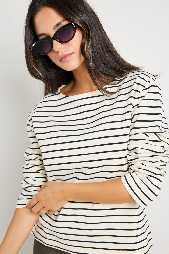 model wears stripe long sleeve black and white boat neck tee