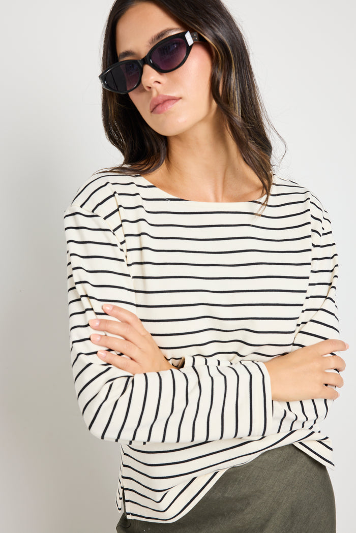 model wears stripe long sleeve black and white boat neck tee