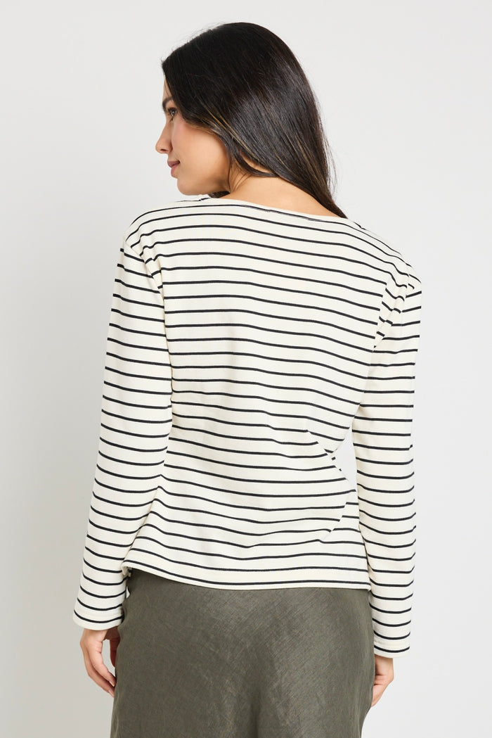 model wears stripe long sleeve black and white boat neck tee