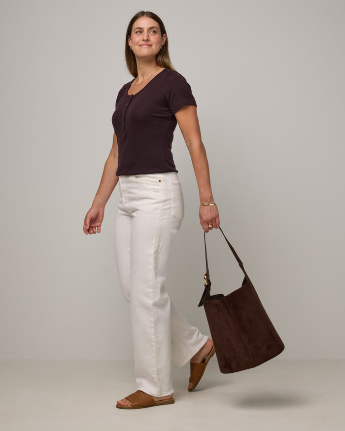 Model wearing Marie Pointelle Henley in Espresso, a dark brown color. Marie Pointelle Henley is a short sleeve, scoop neck, fitted top available in sizes XS-3X.