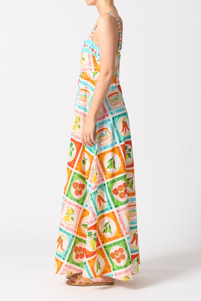 model wears a colourful thin strap maxi dress
