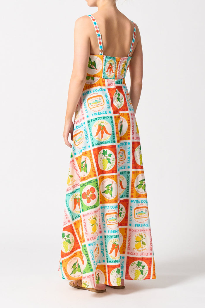 model wears a colourful thin strap maxi dress