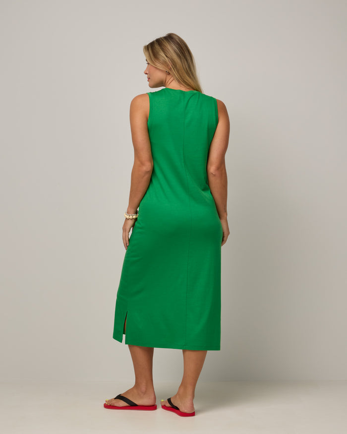 Model wearing Milena Shift Dress in Verde, a bright kelly green color. Milena Shift Dress is a merino wool sleeveless, v-neck, midi shift dress available in sizes XS-3X regular, XS-XL petite.