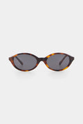 Sunglasses with tortoiseshell frame and dark lenses on a white background