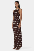 model wearing a brown and white polka dot dress
