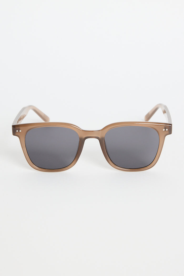 Translucent brown classic square sunglasses with dark tinted lenses, photographed on a white background.