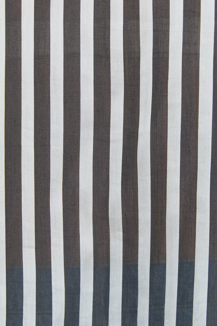 Striped fabric with alternating brown and white vertical stripes on a plain background
