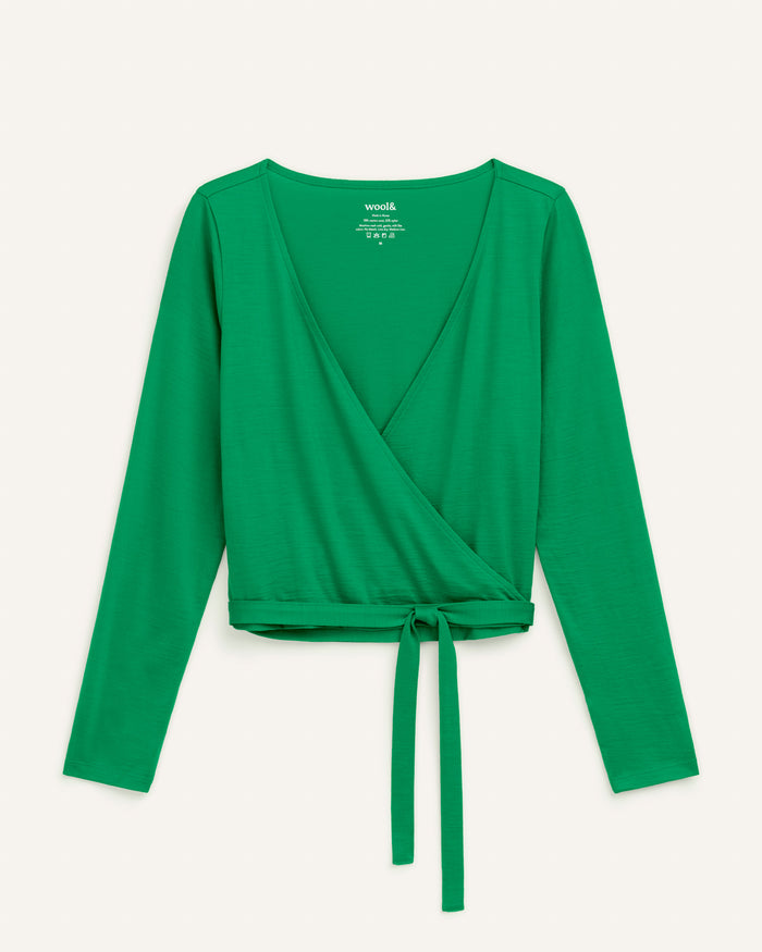 Laydown of Natalia Wrap Top in Verde, a bright Kelly green color. Natalia Wrap Top is a merino wool long sleeve, v-neck, slim fit top available in sizes XS-3X.