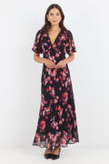 Woman wearing a floral dress on a white background