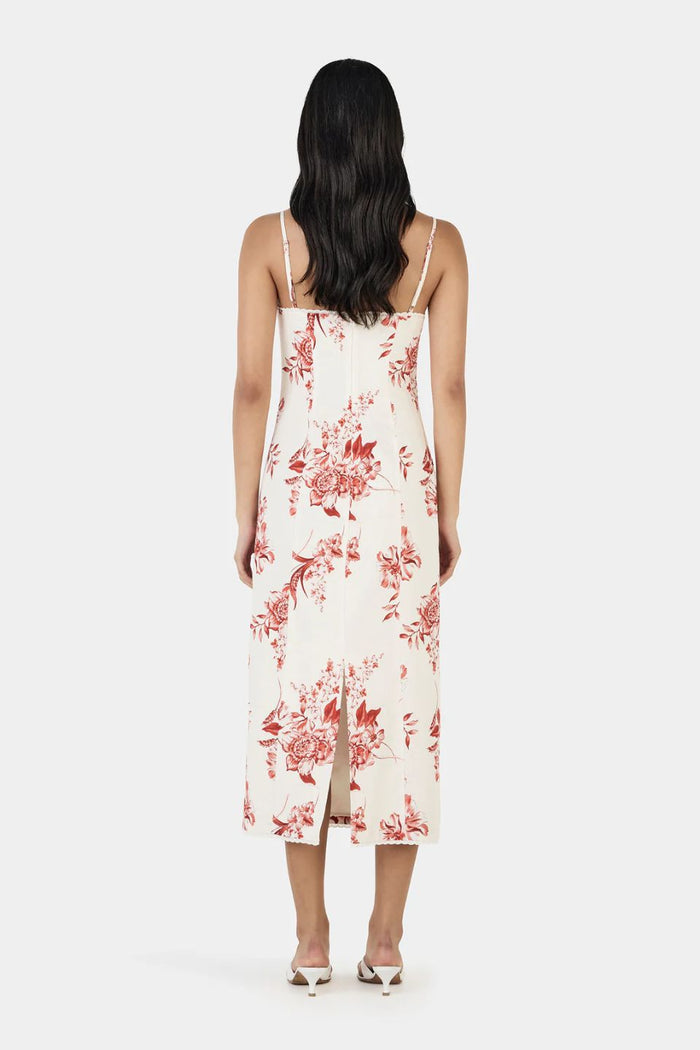 Woman wearing a floral dress on a white background