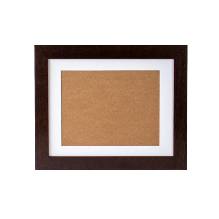 Brown picture frame with cork bulletin board on a white background