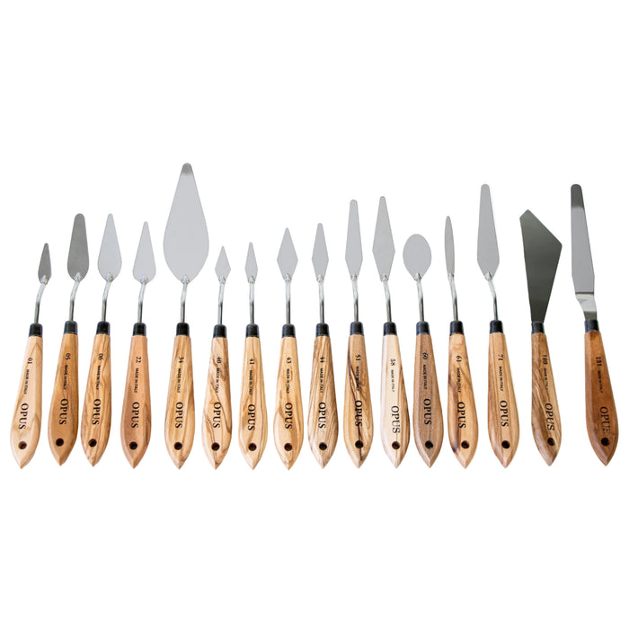 A set of 15 wooden-handled cake and pastry spatulas arranged in a row on a plain white background. The spatulas feature silver stainless steel heads and light brown wood handles with engraved numbers and text.