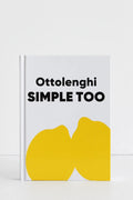 A hardcover book titled 'Ottolenghi SIMPLE TOO' with a white cover, bold black text, and a large yellow abstract shape at the bottom, photographed against a clean white background.