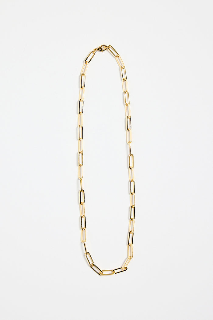 gold-plated brass paperclip chain necklace with elongated links, photographed flat on a white background.