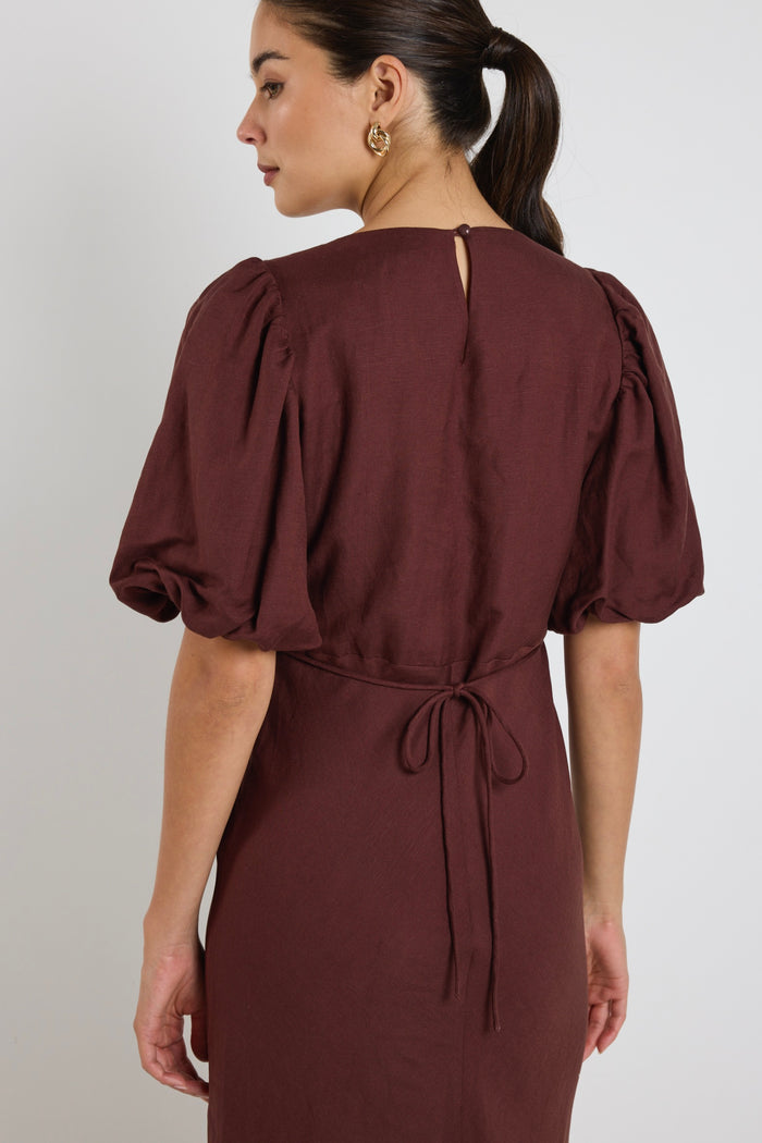 model wears a brown linen puff sleeve maxi dress