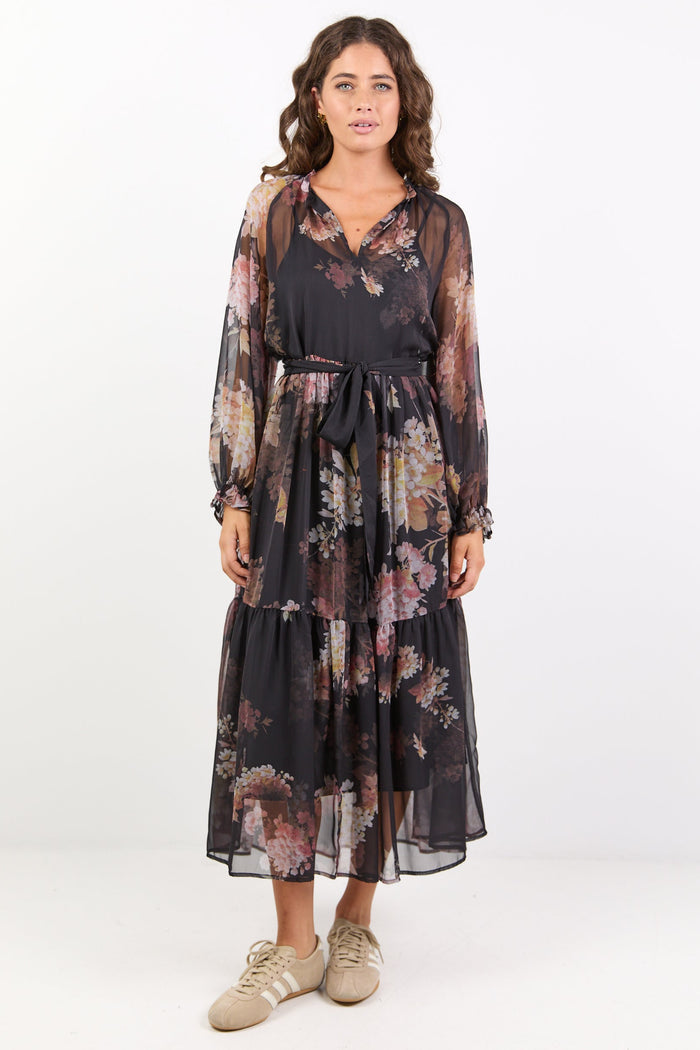 Black dress with floral print, balloon sleeves and tiered skirt.