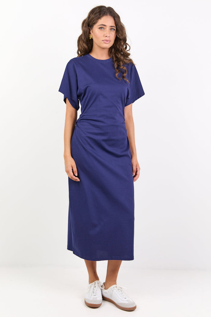 Woman wearing a blue dress on a white background