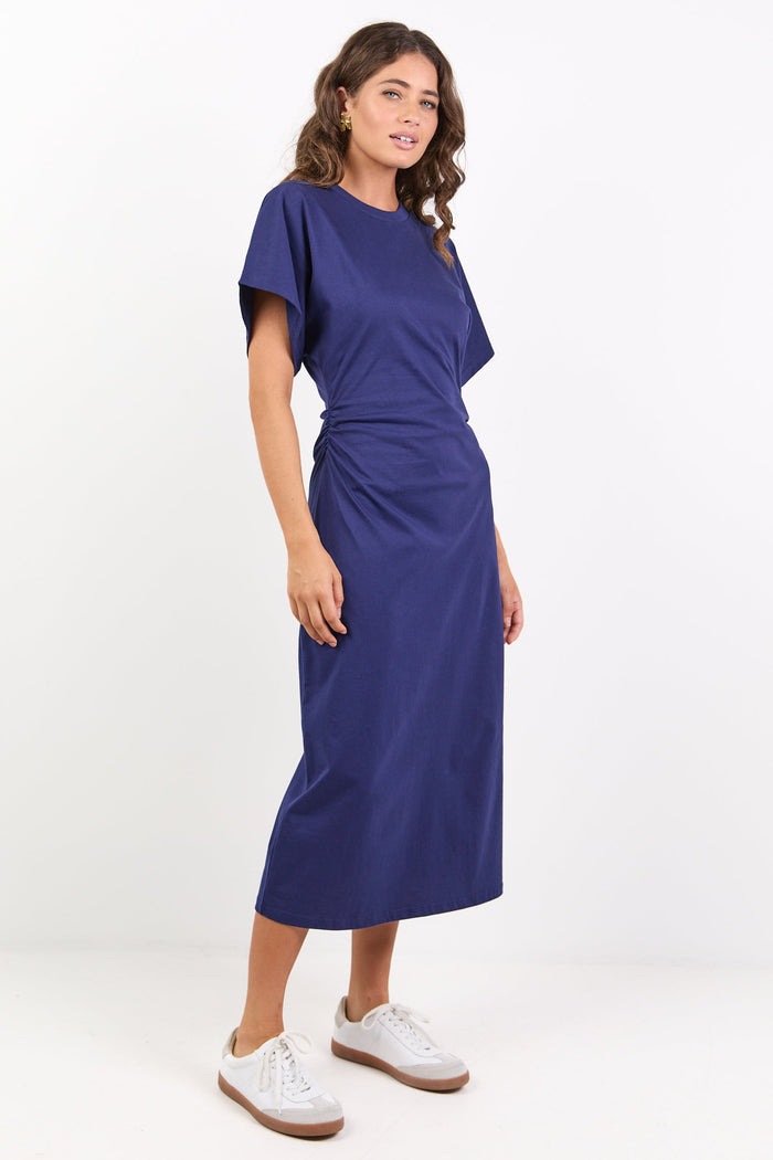Woman wearing a blue dress on a white background