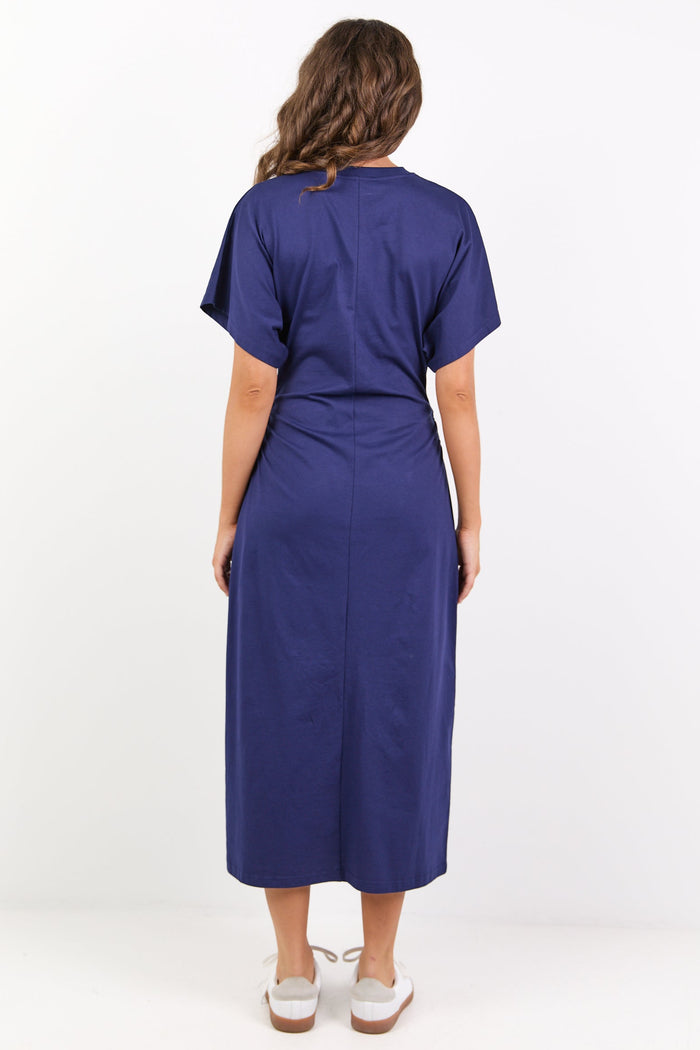Woman wearing a blue dress on a white background